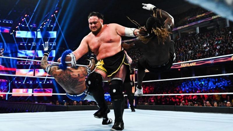The Samoan Submission Machine takes out both Rey Misterio and R Truth at the same time.